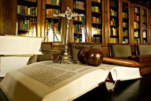 Book with gavel and scale of justice