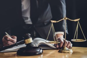 Man with scale of justice and gavel