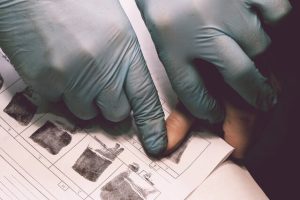 Person taking fingerprints