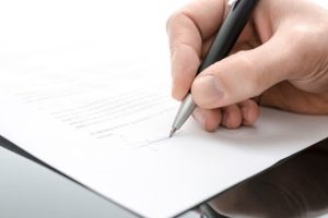Person signing papers
